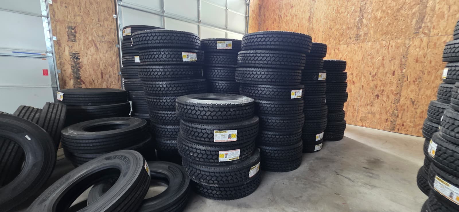 Commercial truck tires stacked at GNE facility